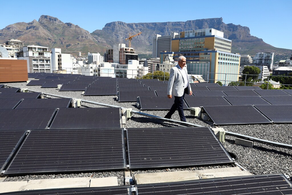 Executive director for energy for the City of Cape Town, Kadri Nassiep, walks past solar panels on the roof of a municipal building in Cape Town, South Africa February 8, 2023: Productive use of renewable energy focuses on how its deployment can directly support livelihoods