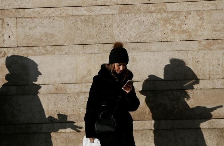 A woman uses her mobile phone in central Kiev, Ukraine December 13, 2016. REUTERS/Valentyn Ogirenko