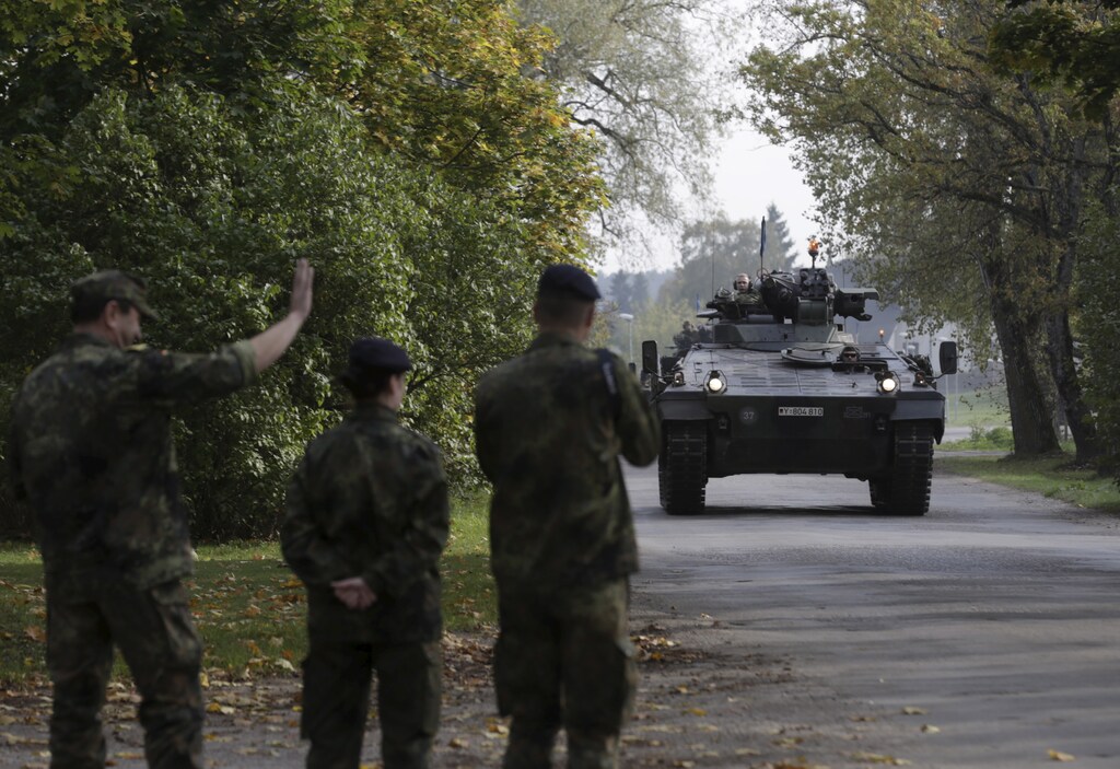 German army soldiers in their infantry fighting vehicle, the "Marder", arrive for the NATO military drill in Adazi, Latvia, October 4, 2015. With signs growing of a thaw between Moscow and Western capitals after the Paris attacks, some of Russia's neighbours fear that European resolve to keep up economic sanctions and military pressure over the Ukraine crisis may be waning. Picture taken October 4, 2015. REUTERS/Ints Kalnins TPX IMAGES OF THE DAY - GF20000064888