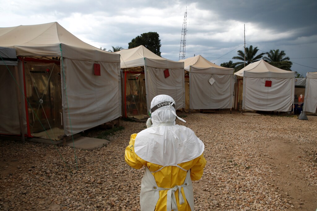 A health worker wearing Ebola protection gear, walks before entering the Biosecure Emergency Care Unit (CUBE) at the ALIMA (The Alliance for International Medical Action) Ebola treatment centre in Beni, in the Democratic Republic of Congo, March 30, 2019. Picture taken March 30, 2019.REUTERS/Baz Ratner - RC1A0066F940