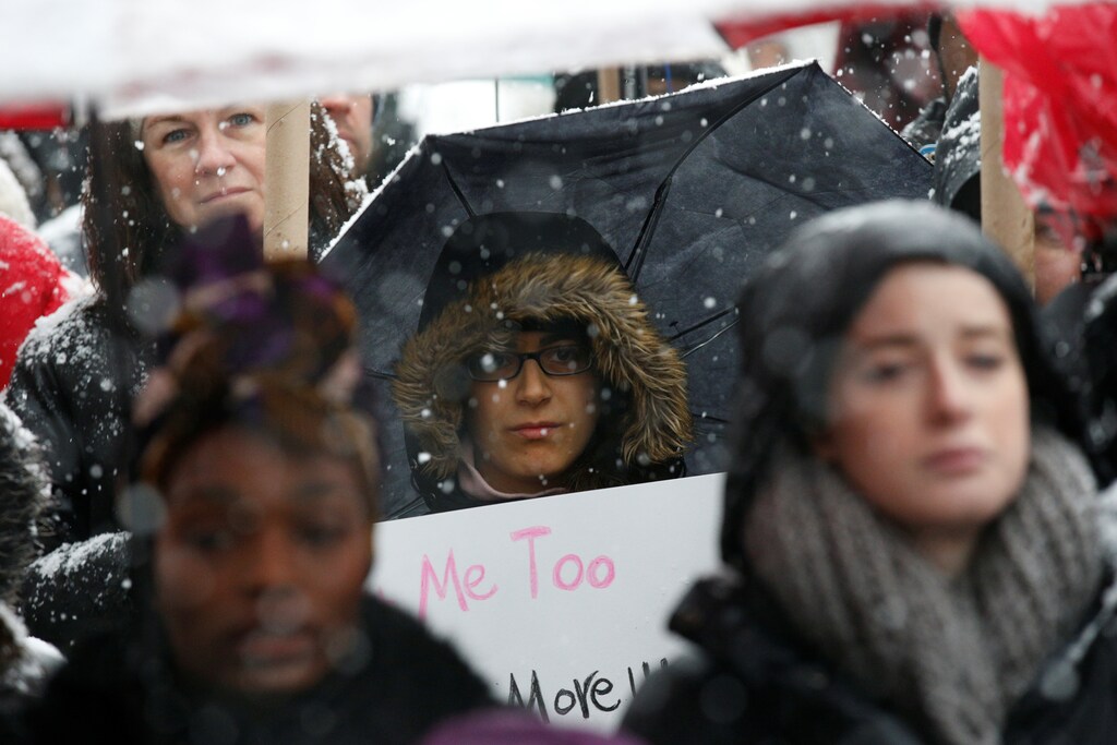 Protesters participate in #MeToo demonstration outside Trump International hotel in New York City, NY, U.S., December 9, 2017