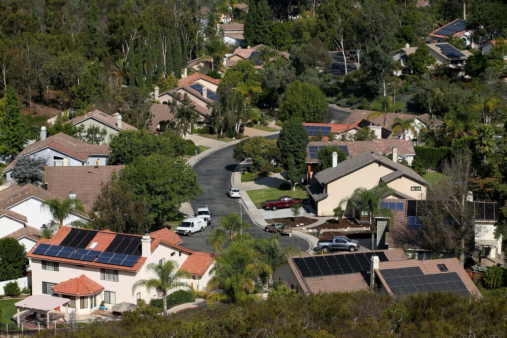 Multiple homes with solar panels are shown in Scripps Ranch, San Diego, California, U.S. October 5, 2016. Picture taken October 5, 2016. REUTERS/Mike Blake - S1AEUJDNKAAA