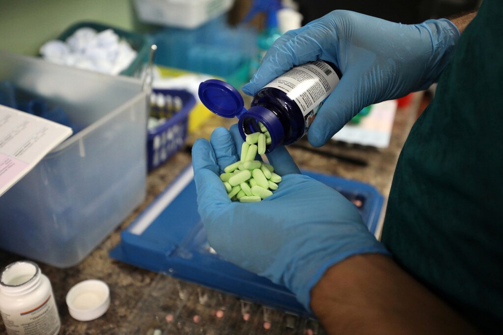 A pharmacist counts prescription drugs in Ottawa, Canada.