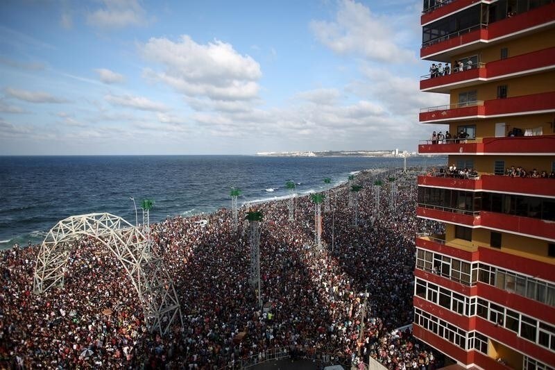 People at the seafront Malecon watch a performance by U.S. electronic music group Major Lazer in Havana, March 6, 2016.
