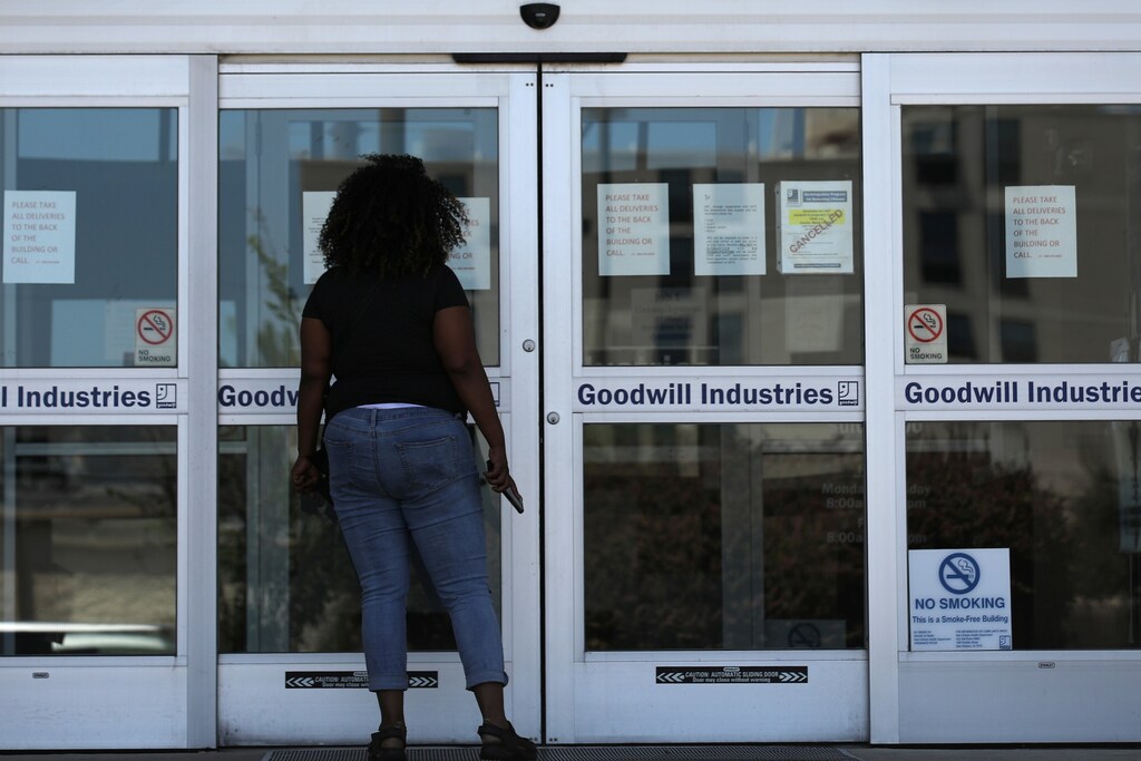 A woman looks for information on the application for unemployment support at the New Orleans Office of Workforce Development, as the spread of coronavirus disease (COVID-19) continues, in New Orleans, Louisiana U.S., April 13, 2020. REUTERS/Carlos Barria - RC224G9LGEBT