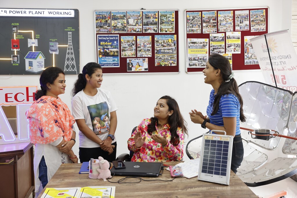 Tridha Tripathi (pictured right) is a solar technician from Madhya Pradesh, India, teaching her colleagues how to install Solar PV.