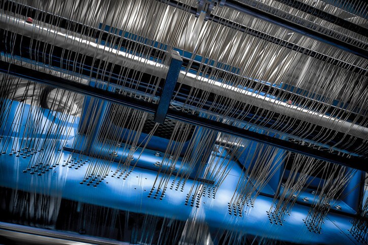 Close-Up of Textile Mill Machinery with Wool