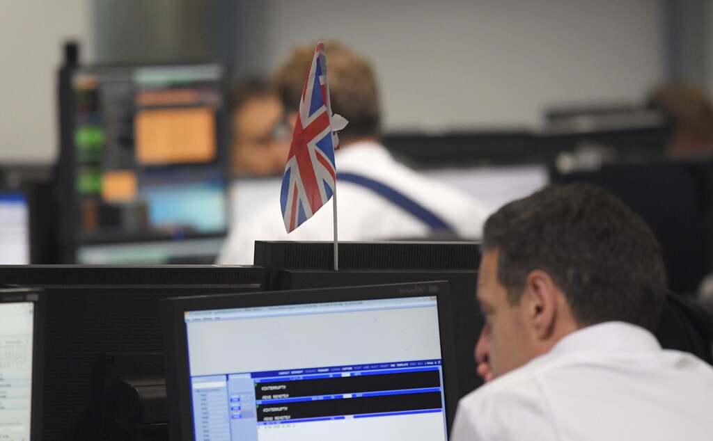 Traders at BGC Partners look at screens after Donald Trump won the U.S. Presidential election, in London, Britain, November 9, 2016. REUTERS/Toby Melville - RTX2SQEO