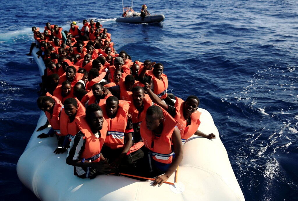 An overcrowded dinghy with migrants from different African countries is followed by members of the German NGO Jugend Rettet as they approach the Iuventa vessel during a rescue operation, off the Libyan coast in the Mediterranean Sea September 21, 2016. REUTERS/Zohra Bensemra TPX IMAGES OF THE DAY