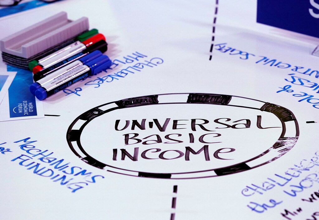 Universal Basic Income (UBI) s written on a table during a session at the World Economic Forum (WEF) annual meeting in Davos, Switzerland January 23, 2018 REUTERS/Denis Balibouse - RC12307A4F80