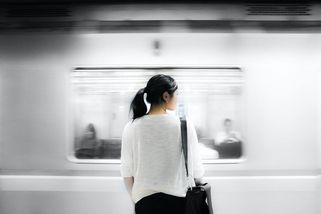 image of a woman waiting for the tube