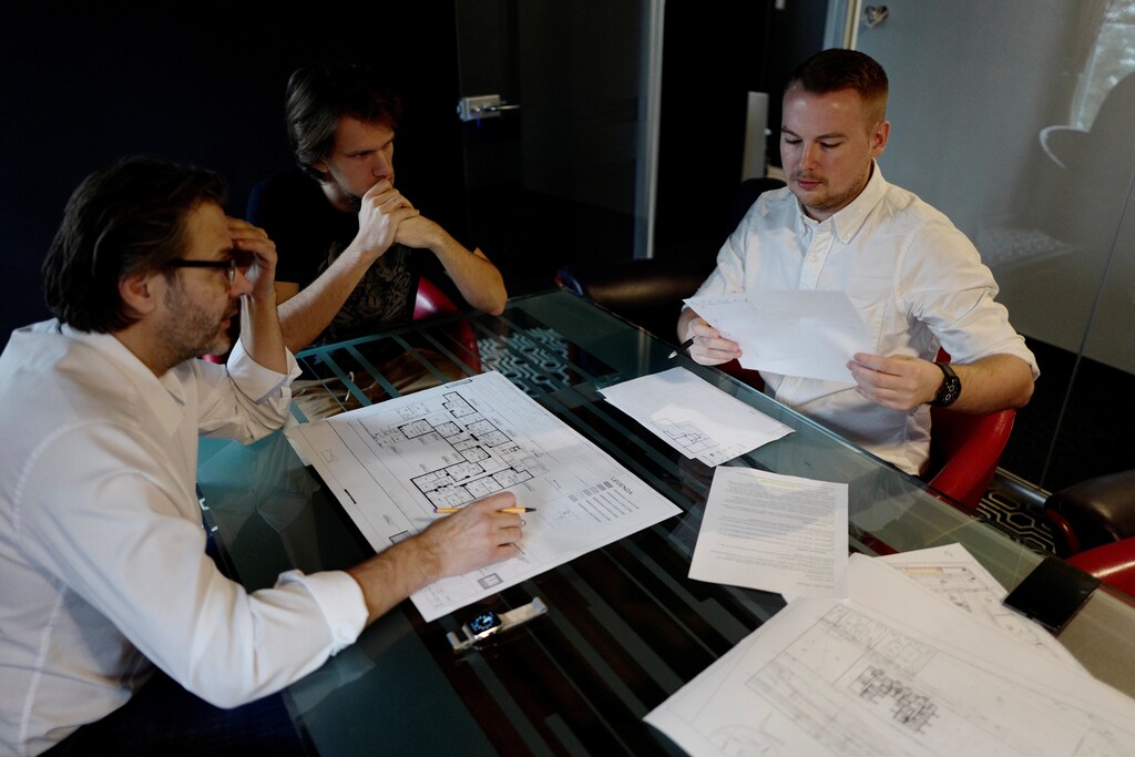 Recruit Damian Krasnodebski, 27, an architect, works with his boss on a project before his 16-day basic training for Poland's Territorial Defence Forces, in Warsaw, Poland, November 30, 2017. Faith in ideals and willingness to serve his country made Krasnodebski want to join the territorial army. "It is so important that you believe in some ideals to do something for your country," he said. "NATO is an old alliance. Hopefully, they will never have to show how it works in practice. I think you have to rely on yourself, on your own strength." REUTERS/Kacper Pempel SEARCH "POLAND MILITARY" FOR THIS STORY. SEARCH "WIDER IMAGE" FOR ALL STORIES. - RC1FCB8C5B50
