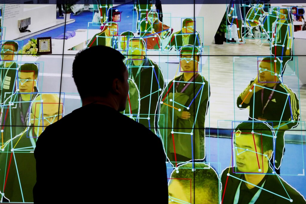 A man looks at a demonstration of human motion analysis software at the stall of the artificial intelligence solutions maker Horizon Robotics during the Security China 2018 exhibition on public safety and security in Beijing, China October 24, 2018. REUTERS/Thomas Peter - RC1A9170A420