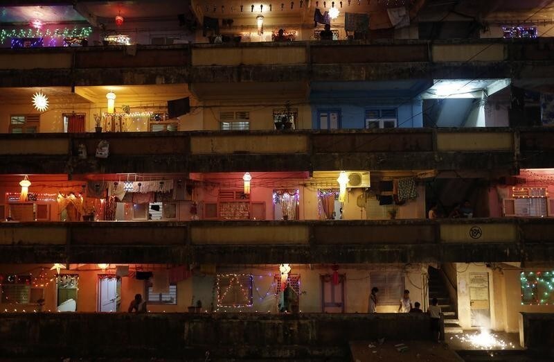 People decorate their houses with lanterns and lights as they celebrate the Hindu festival of Diwali, the annual festival of lights, in Mumbai November 3, 2013. REUTERS/Danish Siddiqui (INDIA - Tags: RELIGION SOCIETY TPX IMAGES OF THE DAY) FOR BEST QUALITY IMAGE ALSO SEE: GF2EA5L07JZ01 - GM1E9B401HY01