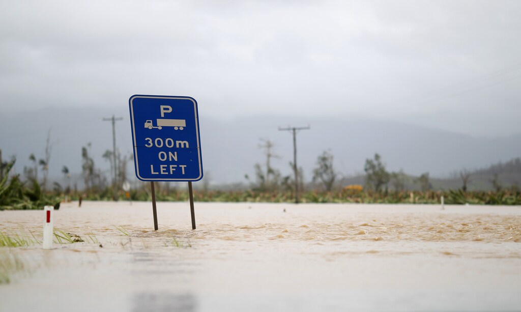 Flood water caused by cyclone Yasi block the main road between the northern Australian towns of Innisfail and Tully.