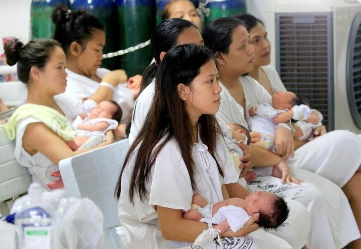 Mothers with their newborn babies wait for a check-up inside a ward in Dr. Jose Fabella Memorial Hospital, in Quiapo city, metro Manila, Philippines May 12, 2018, ahead of Mother's Day celebrations. REUTERS/Romeo Ranoco