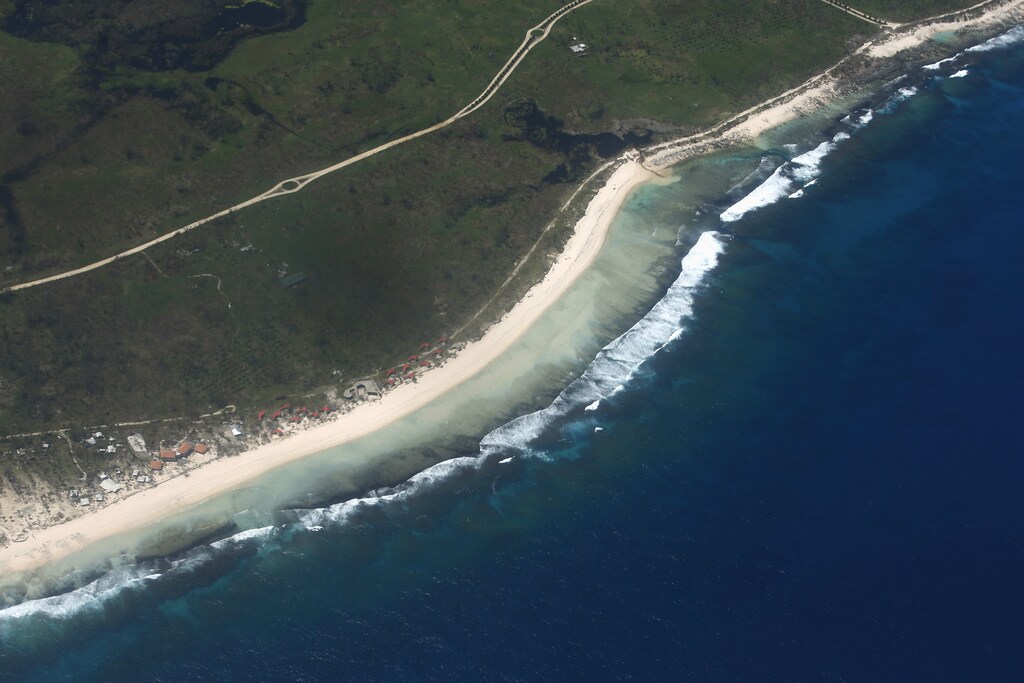 An aerial view of the destruction after Cyclone Pam struck in Port Vila, capital city of the Pacific island nation of Vanuatu March 17, 2015. International aid agencies began emergency flights on Tuesday to some of the remote outer islands of Vanuatu, which they fear have been devastated by a monster cyclone that tore through the South Pacific island nation on Friday and Saturday. The United Nations said the official death toll from the cyclone was 11, revising down its earlier figure of 24, but many officials anticipate that number will rise once they are able to more thoroughly inspect the outer islands of the scattered archipelago. Some 3,300 people were left homeless after the category 5 storm destroyed homes, flattened buildings and washed away roads. REUTERS/Edgar Su (VANUATU - Tags: ENVIRONMENT DISASTER) - GM1EB3H0ZU201