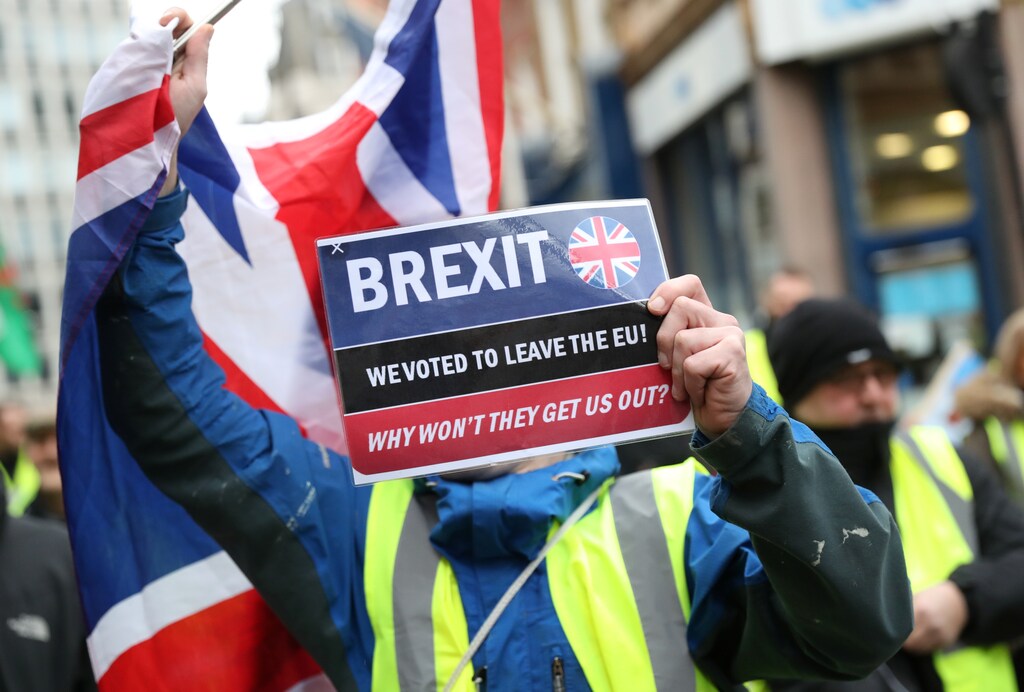 A protester holds a banner before a pro-Brexit demonstration march in central London, January 2019.