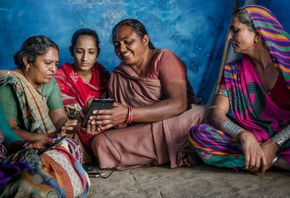 Younger SEWA members train older members using cellphones to expand their microbusinesses using digital payments.