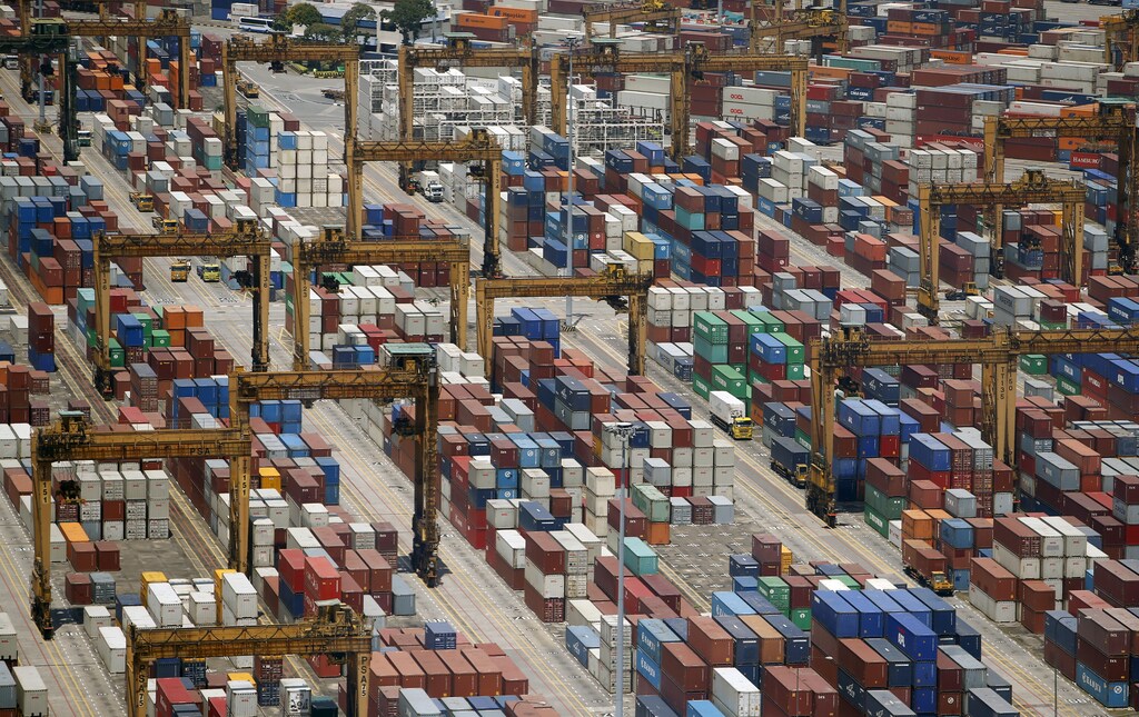 Containers are stacked up at PSA's Tanjong Pagar container terminal in Singapore July 24, 2015. When Singapore celebrated its 50th birthday as an independent country in August, the city state bore little resemblance to the tiny island nation that was expelled from Malaysia in 1965. Its physical stature has swollen by 20 percent thanks to one of the worldâs most aggressive land reclamation drives. REUTERS/Edgar SuPICTURE 4 OF 31 FOR WIDER IMAGE STORY 'EARTHPRINTS: SINGAPORE' SEARCH 'EARTHPRINTS SINGAPORE' FOR ALL IMAGES