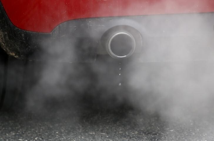 An exhaust emits fumes as a car is driven through Richmond in London, Britain December 2, 2016. REUTERS/Peter Nicholls
