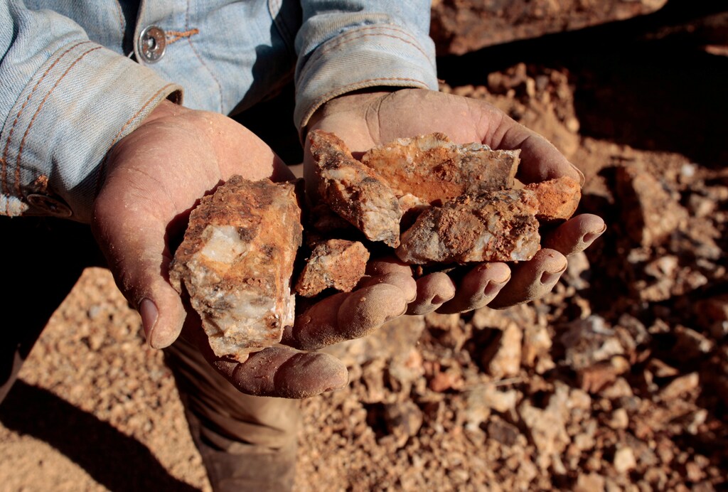 An artisanal miner holds rocks containing gold ore in a mine in Villanueva, Nicaragua