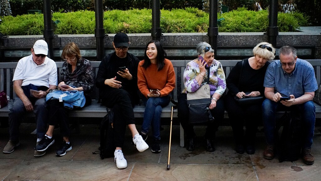 People look at their smartphones at the Rockefeller center in New York City, U.S., May 8, 2019. REUTERS/Eduardo Munoz - RC1EED1117E0