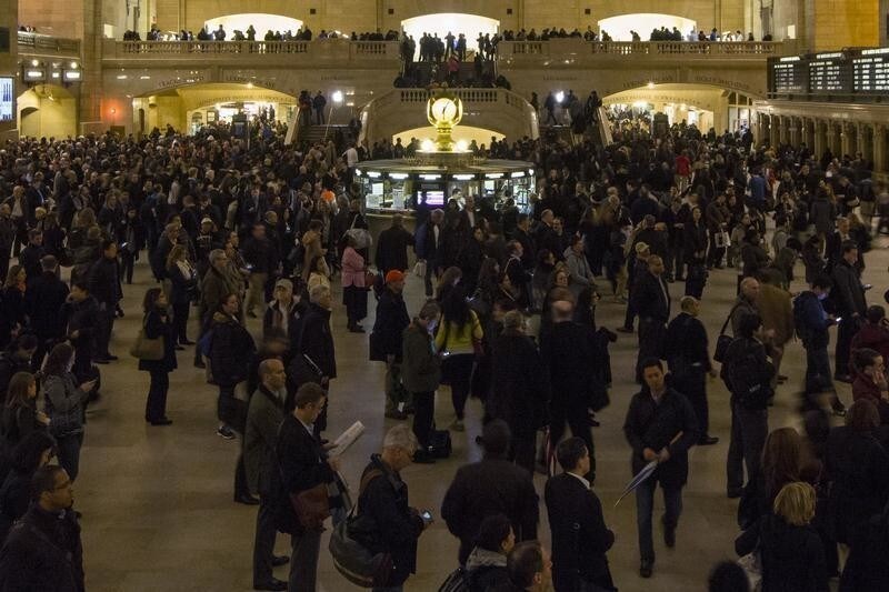 Metro North passengers wait for trains at Grand Central Terminal in New York, March 12, 2014. Metro-North Railroad, which had shut down train traffic moving through Manhattan while it cleared debris from the tracks adjacent to the explosion and collapse of two New York City buildings, announced late afternoon it had restored all commuter train traffic passing through the area. REUTERS/Brendan McDermid (UNITED STATES - Tags: DISASTER SOCIETY TRANSPORT) - GM1EA3D0VQJ01