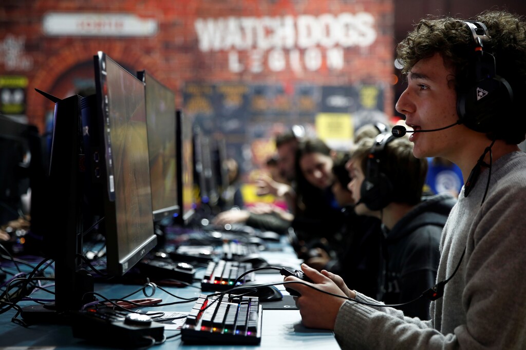 Attendees play Roller Champions by UbiSoft Entertainment at the Paris Games Week (PGW), a trade fair for video games in Paris, France, October 29, 2019. REUTERS/Benoit Tessier - RC1192A33C00