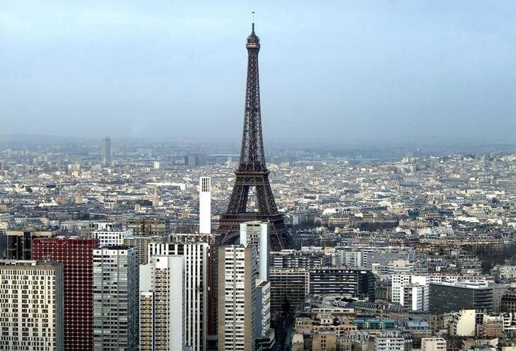 Aerial view of Paris with the Eiffel tower in the background, January 28, 2003.