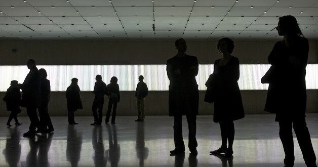 Visitors walk in front of a installation by German artist Gerhard Merz at the Kunsthaus in Bregenz February 17, 2007. The exhibition with works of Gerhard Merz, Damien Hirst, Jeff Koons and Marcel Duchamp opens today and runs until May 15, 2007. REUTERS/Miro Kuzmanovic