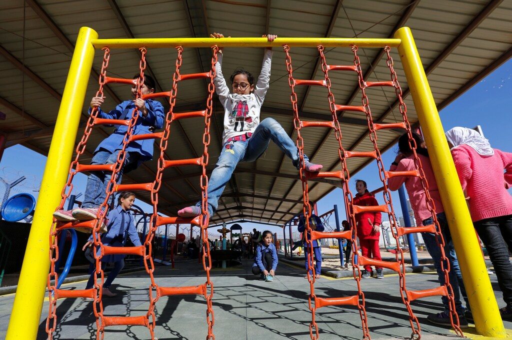 Syrian refugee children play at al-Zaatari refugee camp, Jordan.