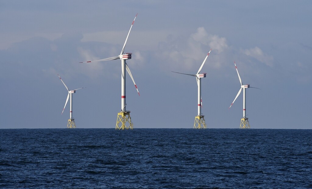 A view shows windmills of several wind farms at the so-called "HelWin-Cluster", located 35 kilometres (22 miles) north of the German island of Heligoland November 5, 2014. As European governments start to curb offshore renewable power subsidies, utilities, wind turbine makers and installers are racing to cut costs to help the industry survive. Britain, Germany and the Netherlands, wary of committing billions of euros when budgets are tight, have announced subsidy cuts in the past 18 months - a blow to the European offshore wind industry which employs nearly 60,000 people. This has led the European Wind Energy Association (EWEA) to slash its forecasts for installed offshore capacity in Europe. However, utilities remain keen to invest in offshore wind - which the EWEA says is the fastest-growing power technology in Europe. To match story RENEWABLES-WINDPOWER/OFFSHORE Picture taken November 5, 2014.
