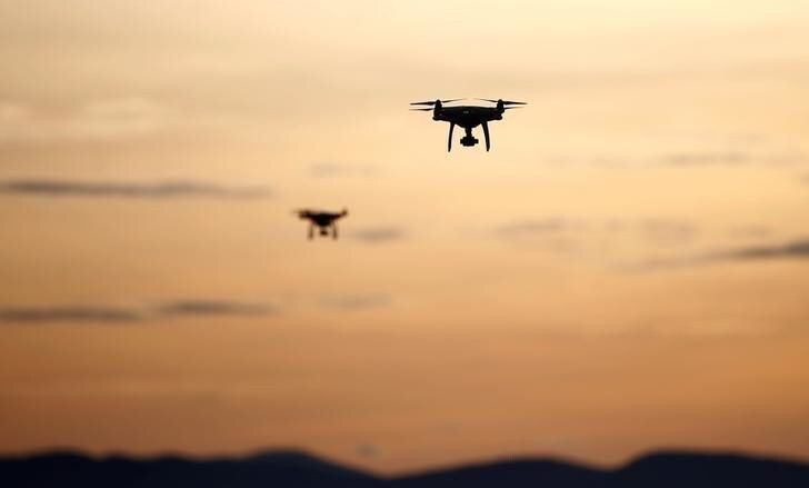 Drones fly above smog blanketed Zenica, Bosnia and Herzegovina December 25, 2016. REUTERS/Dado Ruvic