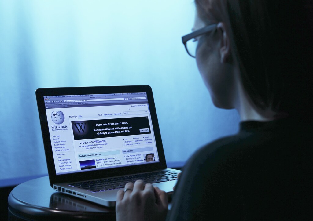 Wikipedia webpage in use on a laptop computer is seen in this photo illustration taken in Washington, January 17, 2012. Wikipedia, the popular community-edited online encyclopedia, will black out its English-language site for 24 hours to seek support against proposed U.S. anti-piracy legislation that Wikipedia founder Jimmy Wales said threatens the future of the Internet. REUTERS/Gary Cameron (UNITED STATES - Tags: SCIENCE TECHNOLOGY CRIME LAW) - RTR2WFJH