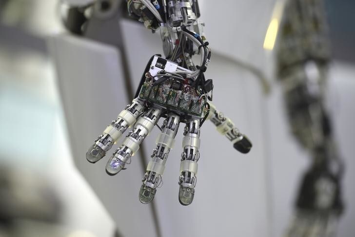 A hand of a robot is seen at the Robotics Innovation Center booth during preparations at the CeBit computer, which will open its doors to the public on March 20, at the fairground in Hanover, Germany, March 19, 2017. REUTERS/Fabian Bimmer