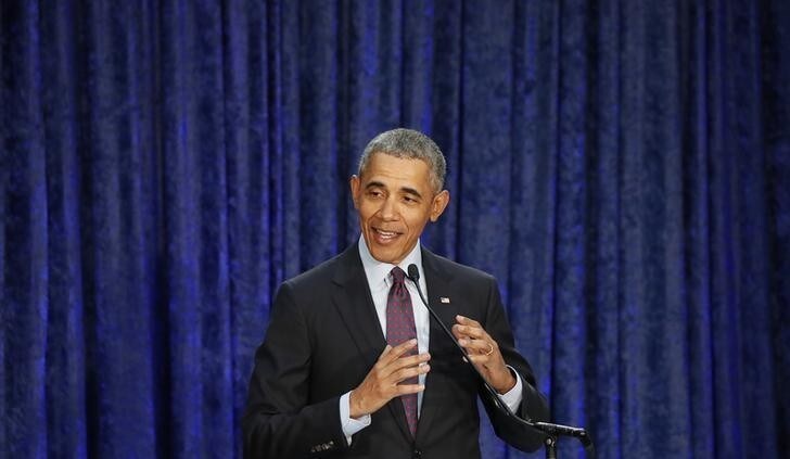 Former U.S. President Barack Obama speaks during an unveiling ceremony for portraits of himself and former First Lady Michelle Obama at the Smithsonian's National Portrait Gallery in Washington, U.S., February 12, 2018. REUTERS/Jim Bourg