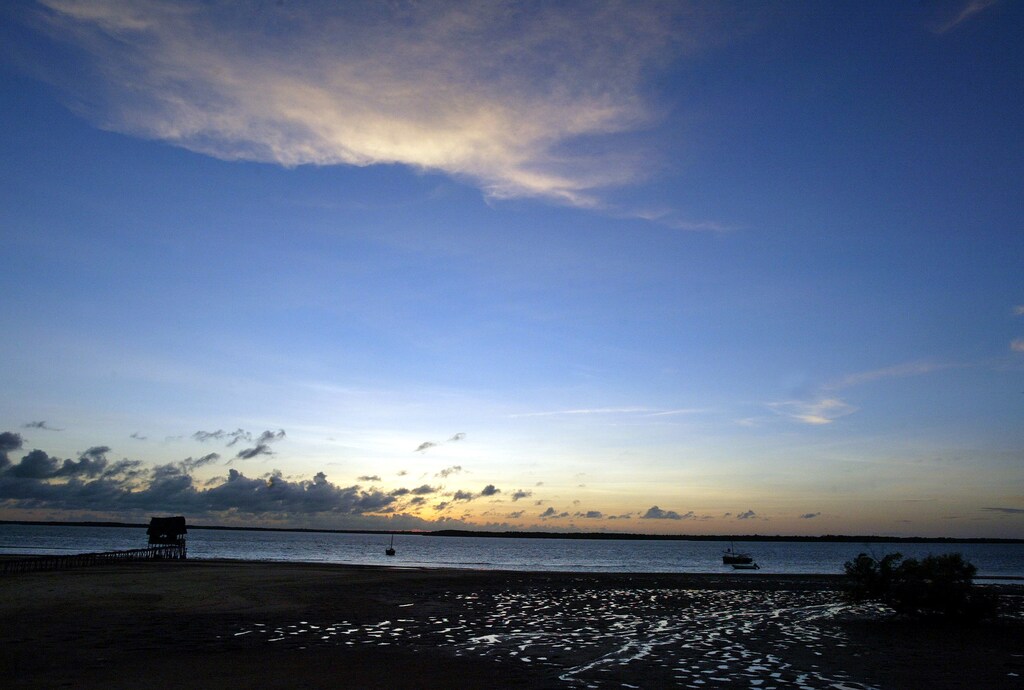 The sun sets on one of the islands of Lamu archipelago, a small group of islands off Kenya's north coast. Lamu began life as a 14th century Swahili settlement, but the island has seen many visitors and influences, including Portuguese explorers, Turkish traders and the Omani Arabs. Lamu is a peaceful tropical island where there are no vehicles and the donkey and the dhow remain the dominant form of transport. Once a tourist attraction, Lamu's beaches and hotels are almost empty as at the beginning of December 2003 the United States renewed a call for US citizens to avoid all non-essential travel to Kenya after warning of possible imminent terrorist attacks. Picture taken December 10, 2003. NO RIGHTS CLEARANCES OR PERMISSIONS ARE REQUIRED FOR THIS IMAGE REUTERS/Antony Njuguna PP03120044 - RP4DRIALVCAA