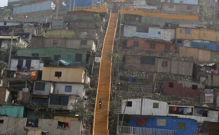 A man walks down the stairs at Pamplona Alta shanty town in the San Juan de Miraflores district of Lima, Peru, June 21, 2017. REUTERS/Mariana Bazo