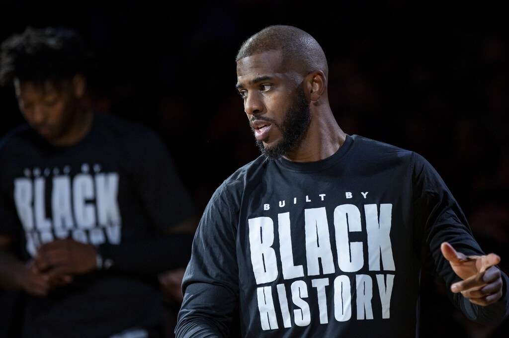 Phoenix Suns guard Chris Paul wears a Black History Month shirt prior to the game against the Brooklyn Nets at Footprint Center.