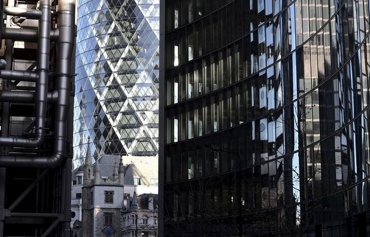 St. Andrew Undershaft church is seen surrounded by skyscrapers, in the City of London, Britain December 16, 2014. The architectural landscape of London never stands still. The City of London, as the largest financial services and banking centre in Europe, is no exception. Silhouettes of cranes pepper the horizon and buildings shoot skywards. Amid all this change there appears to be one constant: over 50 churches and other places of worship remain in the Square Mile. REUTERS/Toby Melville PICTURE 3 OF 15 - SEARCH "MELVILLE WORSHIP" FOR ALL IMAGES