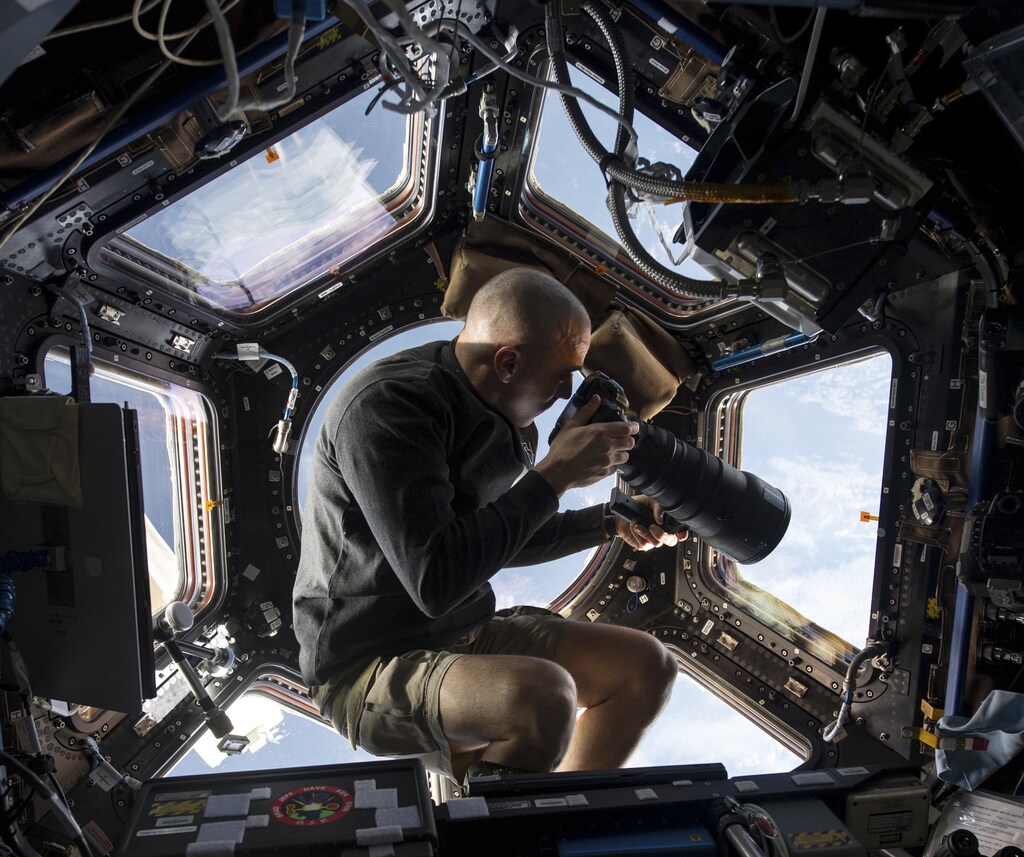 NASA picture inside the Cupola aboard the International Space Station shows NASA astronaut Chris Cassidy, an Expedition 36 flight engineer, using a 400mm lens on a digital still camera to photograph a target of opportunity on Earth some 250 miles below him in this NASA image released on June 10, 2013. Cassidy has been aboard the orbital outpost since late March and will continue his stay into September. REUTERS/NASA/Handout via Reuters (OUTER SPACE - Tags: SCIENCE TECHNOLOGY TPX IMAGES OF THE DAY) ATTENTION EDITORS - THIS IMAGE WAS PROVIDED BY A THIRD PARTY. FOR EDITORIAL USE ONLY. NOT FOR SALE FOR MARKETING OR ADVERTISING CAMPAIGNS. THIS PICTURE WAS PROCESSED BY REUTERS TO ENHANCE QUALITY. AN UNPROCESSED VERSION WILL BE PROVIDED SEPARATELY - GM1E96A1TX601