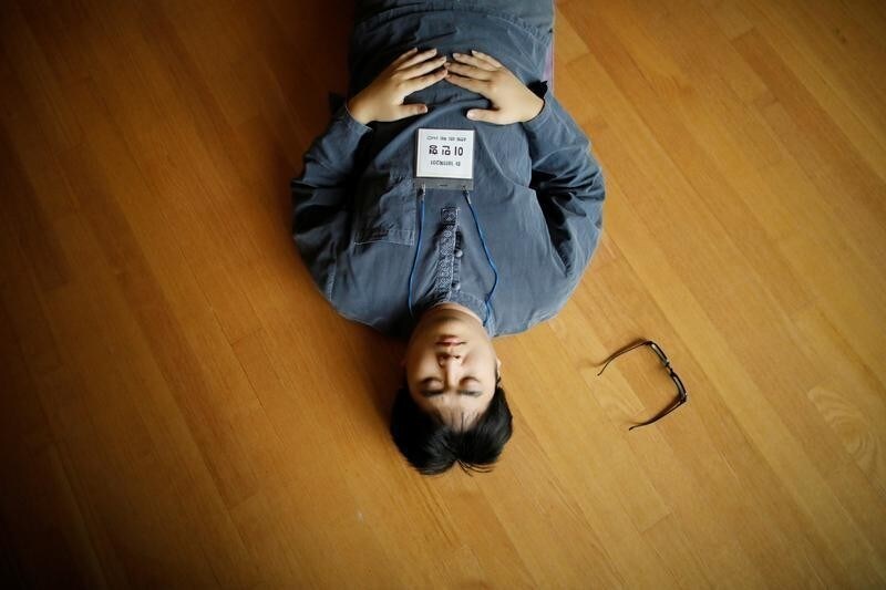 A participant meditates before being locked up in a cell at Prison Inside Me, a mock prison facility, in Hongcheon, South Korea, November 10, 2018. Since 2013, the facility has hosted more than 2,000 inmates, many of them stressed office workers and students seeking relief from South Korea's demanding work and academic culture. REUTERS/Kim Hong-Ji SEARCH "PRISON RETREAT" FOR THIS STORY. SEARCH "WIDER IMAGE" FOR ALL STORIES. - RC16B04AA360
