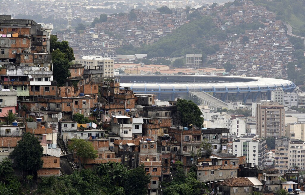 The Maracana stadium is seen between Turano slum (L) and Mangueira slum in Rio de Janeiro May 14, 2010.