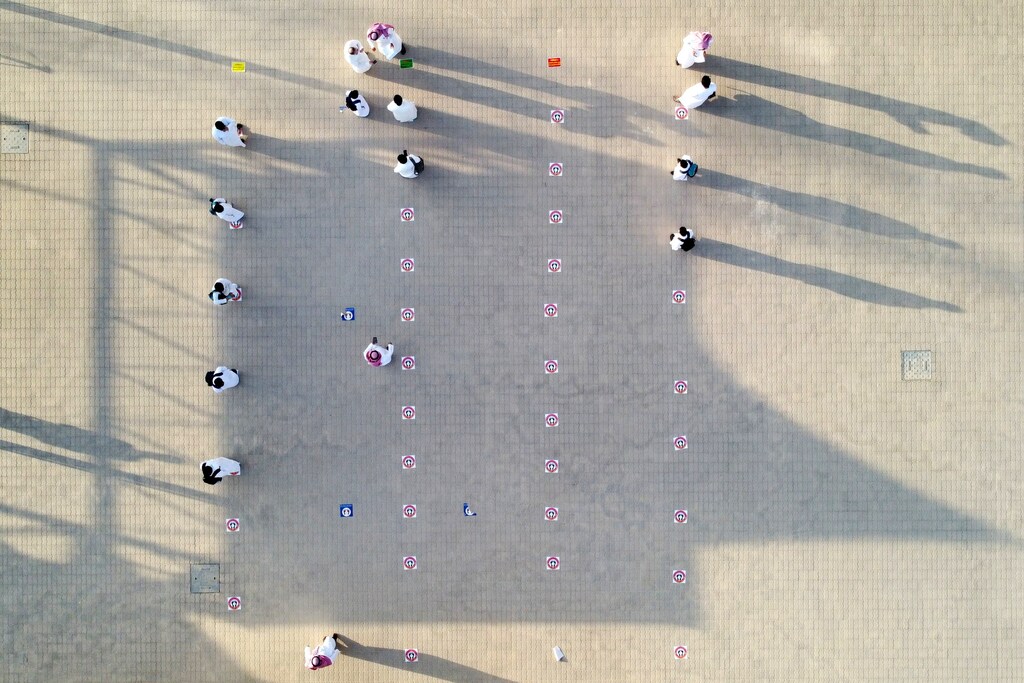 Saudi students stand on social distancing markers at a school in Riyadh, Saudi Arabia August 30, 2021. Picture taken with a drone. REUTERS/Mohammed Benmansour - RC2IFP9ZCXD2
