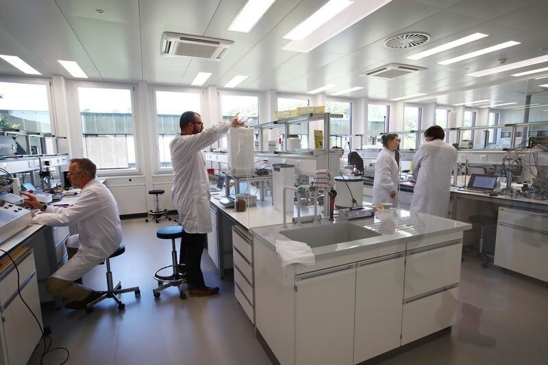 Staff work in a laboratory during a media visit for the inauguration of the Nestle Institute of Packaging Sciences in Lausanne, Switzerland, September 12, 2019. REUTERS/Denis Balibouse - RC12C8E1D070