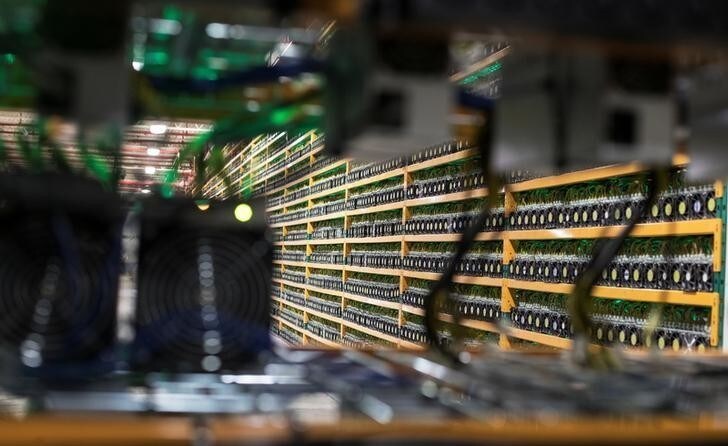 A wall of miners, is seen through a new installation, at the cryptocurrency farming operation, Bitfarms, in Saint-Hyacinthe, Quebec, Canada, February 2, 2018. Picture taken February 2, 2018. REUTERS/Christinne Muschi