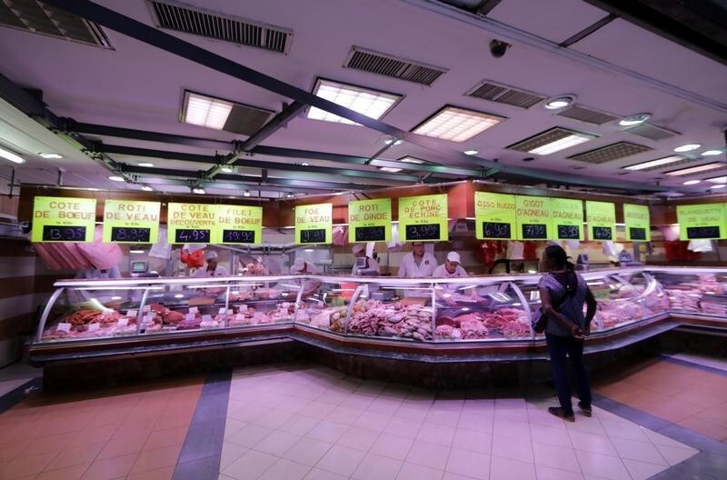A customer waits at the Boucherie St Francois butcher shop in the old city of Nice, France July 28, 2017. REUTERS/Eric Gaillard - RC1169059FE0