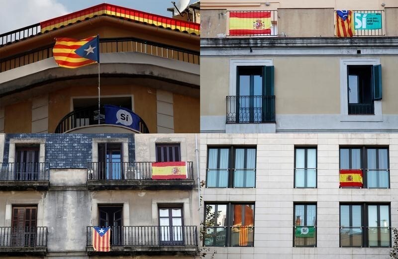 A combination picture shows Estelada (Catalan separatist flag), banners that read "Yes", and Spanish flags hanging from balconies in Barcelona, Spain, October 14, 2017. REUTERS/Gonzalo Fuentes - RC1BE2360A30