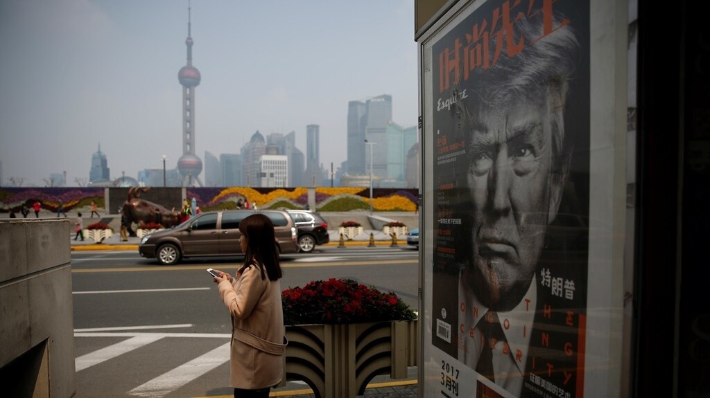 A Chinese magazine poster showing U.S. President Donald Trump is displayed at a newsstand in Shanghai